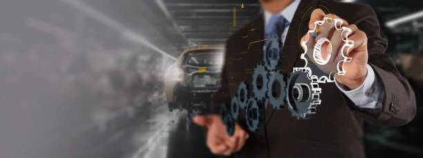 A professional in a suit interacts with a digital interface, showcasing gear icons and an EV car on an assembly line. This image represents the use of AI technology in the electric vehicle industry for automation un profesional con traje interactúa con una interfaz digital, mostrando íconos de engranajes y un automóvil eléctrico en una línea de ensamblaje. esta imagen representa el uso de la tecnología de ia en la industria de los vehículos eléctricos para