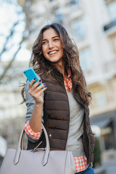 istock Texting in the city 2160032028