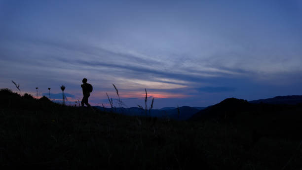 istock Man walking in nature during blue hour time. 2160037552