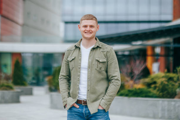 istock Fit and Happy Smiling Young Man Poses for a Portrait 2160038321