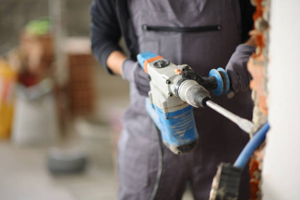 istock Close up of a construction worker using rotary hammer 2160038944