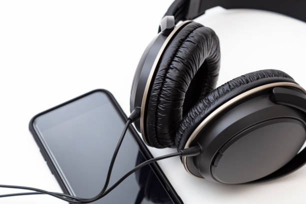 istock Headphones and smartphone on white background 2160039114