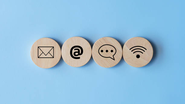 istock Website page contact us or e-mail marketing concept, Customer support hotline Contact us people connection. cube wood with the email, call phone, address, Chat message icons  on blue background. 2160041143