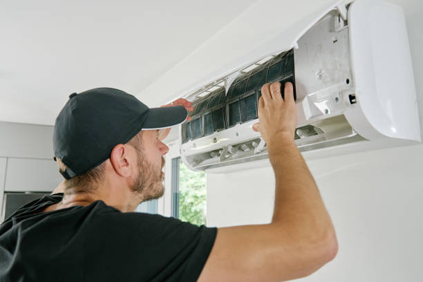 istock Air conditioner maintenance. Male technician repairing cooling system 2160042834