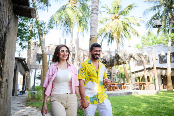 istock Happy Saudi vacationers walking on resort grounds 2160043995
