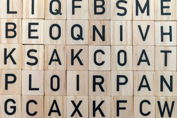 background from alphabets on wooden surface. The concept of thinking development, grammar.