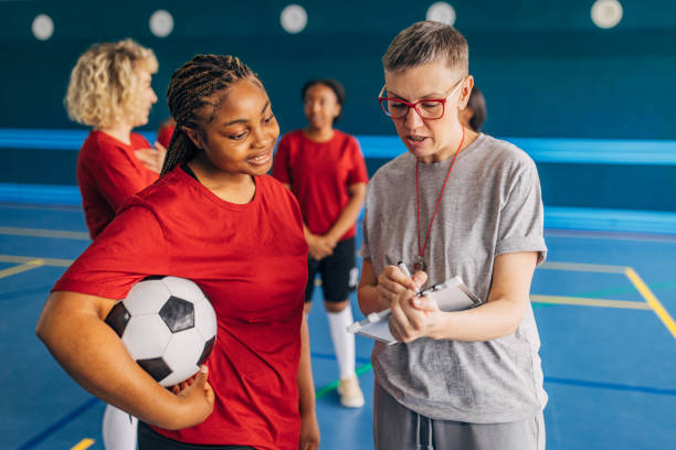 istock Coach and player discuss tactics during soccer practice. 2160047613