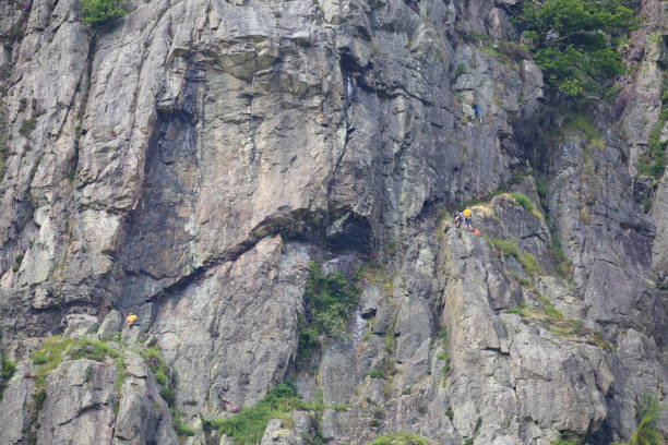istock Rock climbing on Raven Crag, Langdale. 2160048316