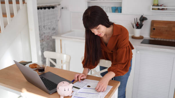 istock Young woman counting money she saved 2160052040