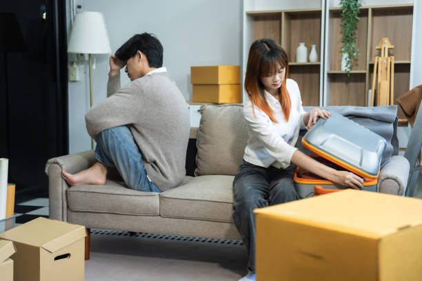 istock Unhappy young couple sitting apart, having problems in relationship, thinking of breaking up or divorce, upset, family lovers, man and woman avoid talking in relationship problems. 2160052411