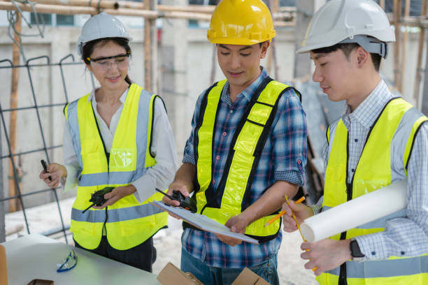 istock civil engineer and worker discussing issues at the construction site in the morning. 2160052445