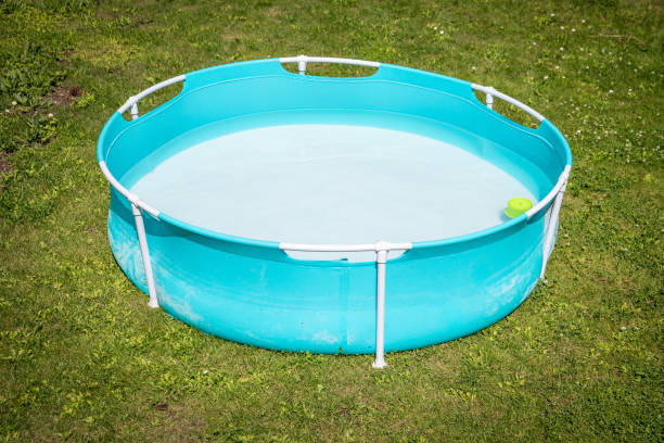 istock Blue children's pool on the grass for playing in hot weather 2160052722