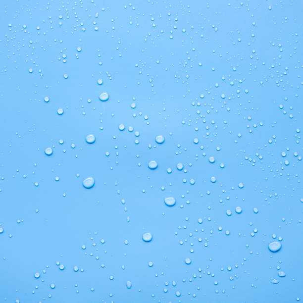 istock Water or rain drops on blue background 2160055170