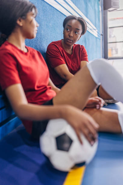 istock Focused discussion between teammates before soccer game 2160057290