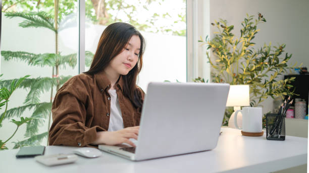 istock Beautiful young entrepreneur working with laptop at home office. 2160059343