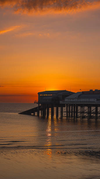 istock A beautiful sunrise washing over cromer Pier 2160059557