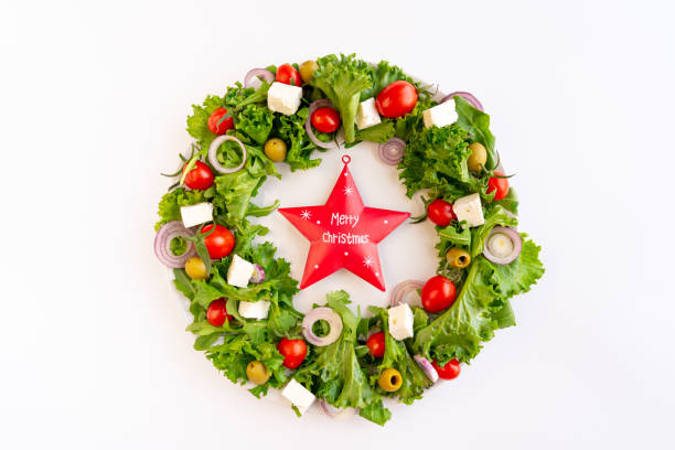 istock Christmas wreath salad on dark background 2160063315