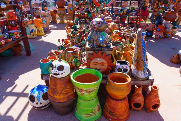 San Diego, California - April 16, 2024: Colorful ceramic sculptures, pots, and decorations in a bustling outdoor market.