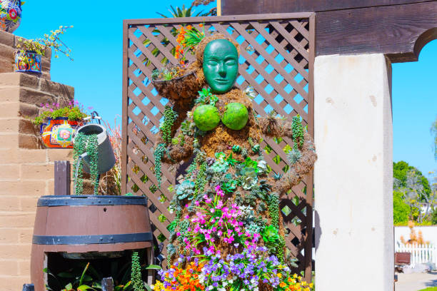 San Diego, California - April 16, 2024: Statue adorned with flowers and greenery displayed at Old Town Market in San Diego.