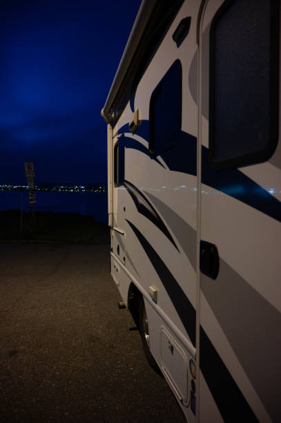 istock Side view of motor home at night 2160065625