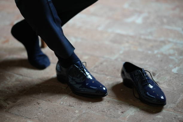 High Angle view of black leather men's shoes on white background.