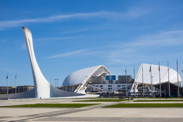 Sochi, Russia - 16 April, 2023: View on on Sochi Medals Plaza with stele-torch for the Olympic flame and Fisht Olympic Stadium in the Sochi Olympic Park.