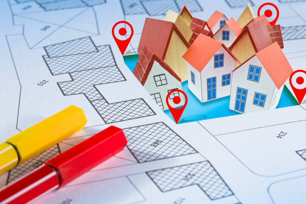 istock Land plot management - Real estate concept with a vacant land and cadastral parcel available for building activity and construction industry with residential home model 2160076188