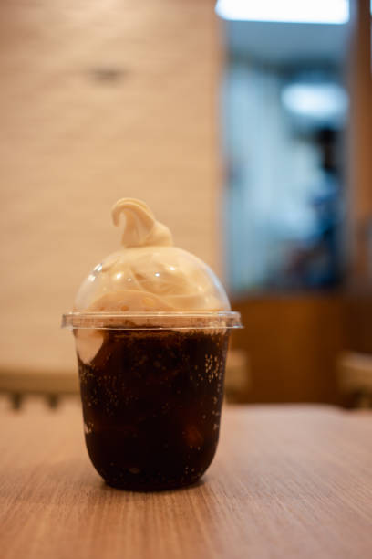 istock A plastic glass of soft drink topped with vanilla soft serve ice cream 2160077385