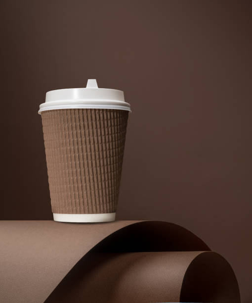 istock Aesthetic image of a hot paper cup on a brown backdrop 2160078220