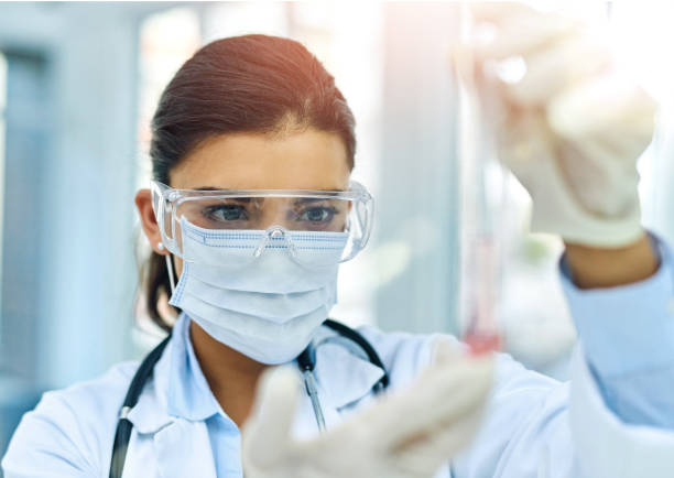 istock DNA, sample and science with woman in laboratory for breakthrough, discovery or experiment. Blood, research and test tube with scientist at work on clinical trial for biology, cure or vaccine 2160080506