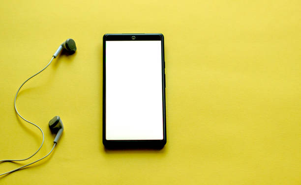 istock smartphone with blank screen and headphones, music concept 2160082820