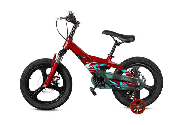 istock Red children's bicycle with training wheels isolated on white 2160085346
