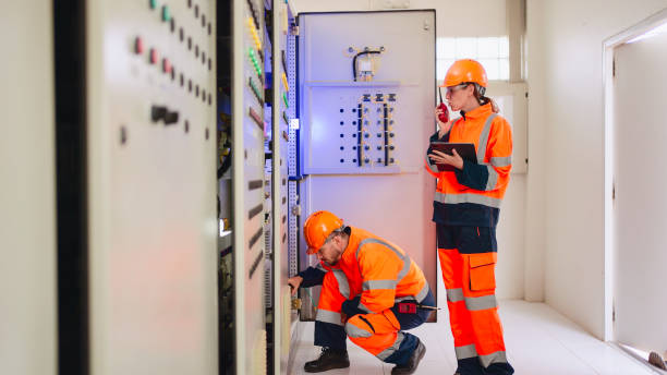 istock Two Electrical engineer working in control room at industry factory. 2160086785