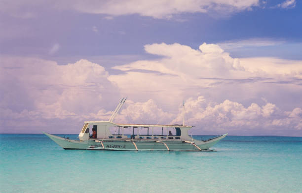 Boracay, Philippines - June 24, 2024: Filipino boat anchored on the coast of the island