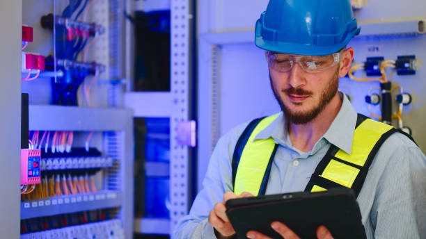 istock Electrical engineer working in control room at industry factory. 2160086818