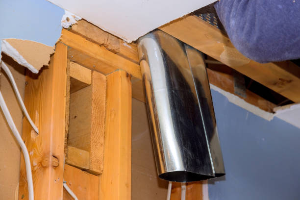 istock Course of reconstructing house, a ventilation hood is installed above stove in kitchen 2160086935