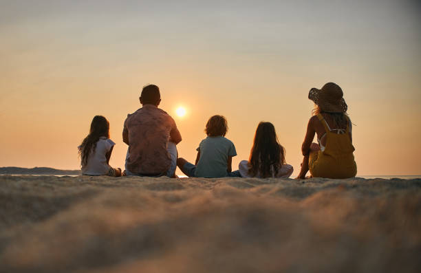 istock A family enjoying a tropical paradise beach during sunset 2160087015