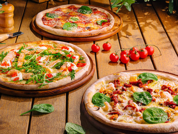istock Gourmet italian pizzas on rustic wooden table 2160087090