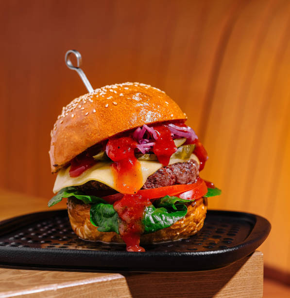 istock Gourmet burger on elegant serving tray 2160087113