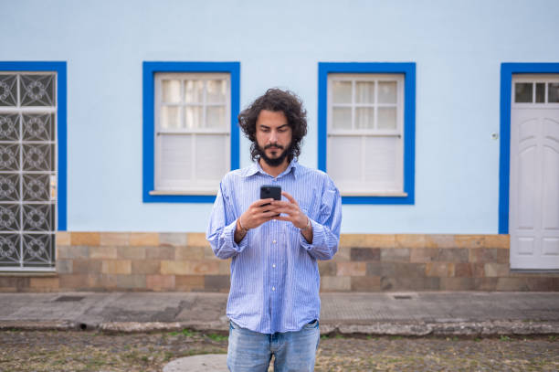 istock Portrait of a man using on the street 2160090714