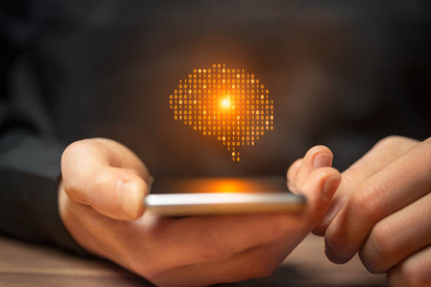 istock Artificial intelligence brain symbol on smartphone in mens hand 2160091447