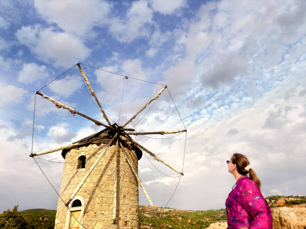 Ancient stone windmill on hill over sky in Foca, Izmir, Aegean Turkey