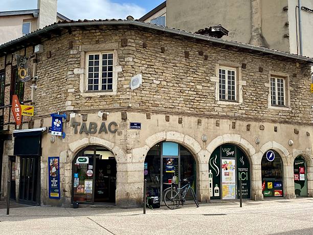 France - Bourg-en-Bresse - medieval houseA pretty little stone building from the medieval period, currently housing a tobacconist in the city center of Bourg-en-Bresse.April 27, 2024