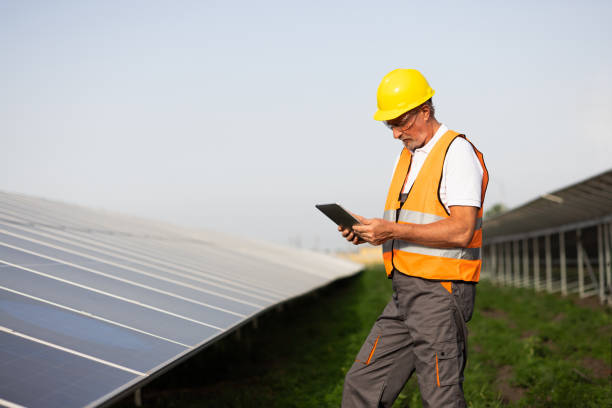 istock Mature technician inspecting the work of solar energy collectors 2160096335