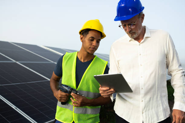 istock Young technician and his manager planning the corrections on solar panels 2160096430