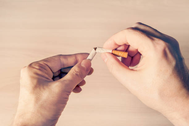 istock Broken Cigarette in the Hands Closeup 2160097139