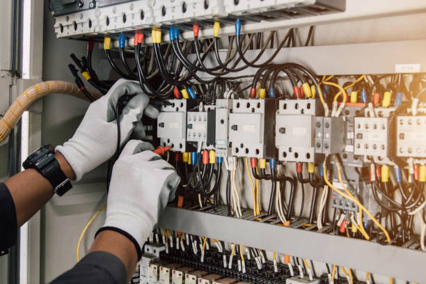 istock Electrician engineer tests electrical installations and wires on relay protection system. 2160101679