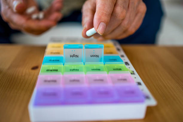istock Senior man organizing medicines at the home 2160104583