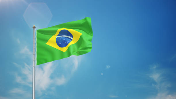 istock Brazil Flag Waving in the Wind in Blue Sky 2160105134
