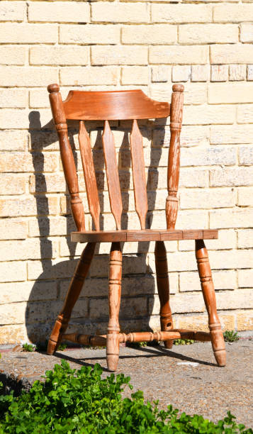 istock Abandoned Chair Sits Besides Brick Building 2160106968
